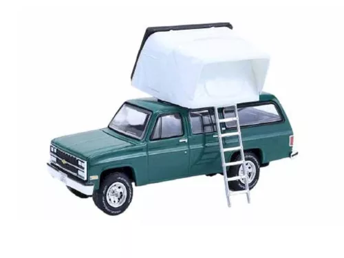Greenlight - 1:64 1990 Chevrolet Suburban - Green with Modern Rooftop Camper  - The Great Outdoors Series 4